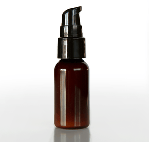 small-2oz-amber-bottle-of-Tierra-Mia-Organics-cleansing-oil-on-white-backdrop